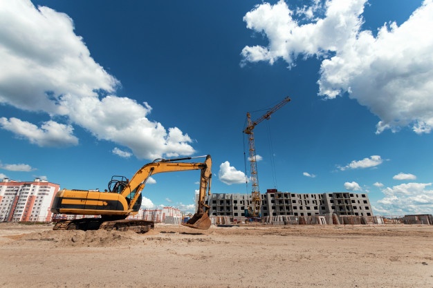 excavator construction site against background tower crane 99433 155